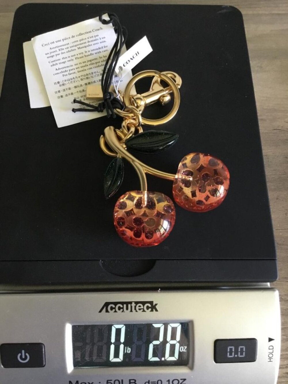 Coach Gold Cherry Keychain with Red and Green Accents